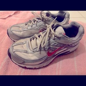 White with pink stripe Nike. Good shape